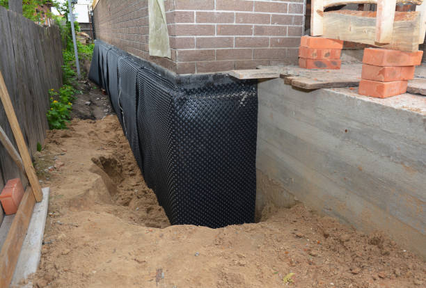 SJ Waterproofing Pros technician performing targeted Exterior Waterproofing assessment in Newbern, AL